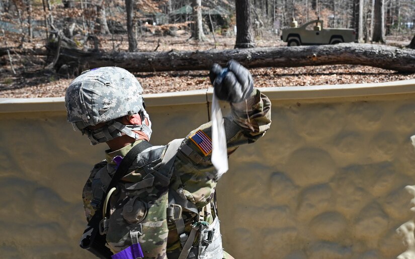 A U.S. Army Soldier throws a simulated hand grenade at a target during a training exercise at Joint Base Langley-Eustis, Virginia, March 10, 2021.