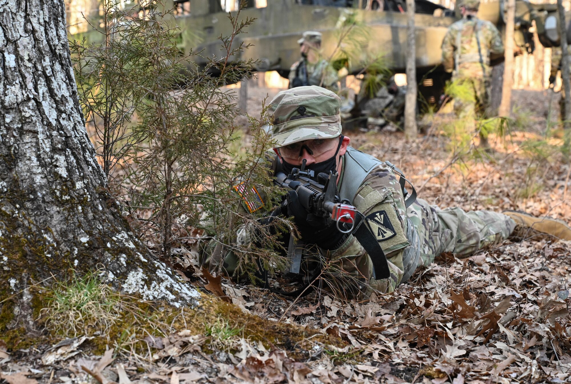 A U.S. Army Soldier scans his sector of fire while his battle buddies recover sensitive items from a simulated downed aircraft during a training exercise at Joint Base Langley-Eustis, Virginia, March 10, 2021.