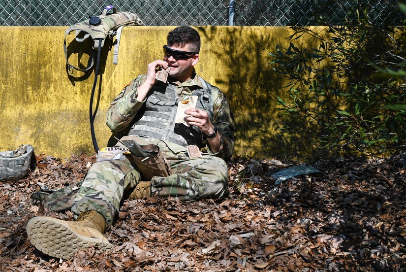 A U.S. Army Soldier opens part of his MRE (Meal Ready to Eat) during a training exercise at Joint Base Langley-Eustis, Virginia, March 10, 2021.