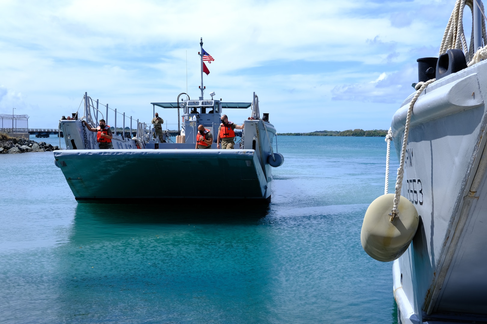 Puerto Rico National Guard Soldiers assigned to Joint Task Force - Puerto Rico arrive in a Mechanized Landing Craft at the Maritime Transport Authority Port at Ceiba, Puerto Rico, March 15, 2021. The PRNG is helping deliver key supplies to several islands.