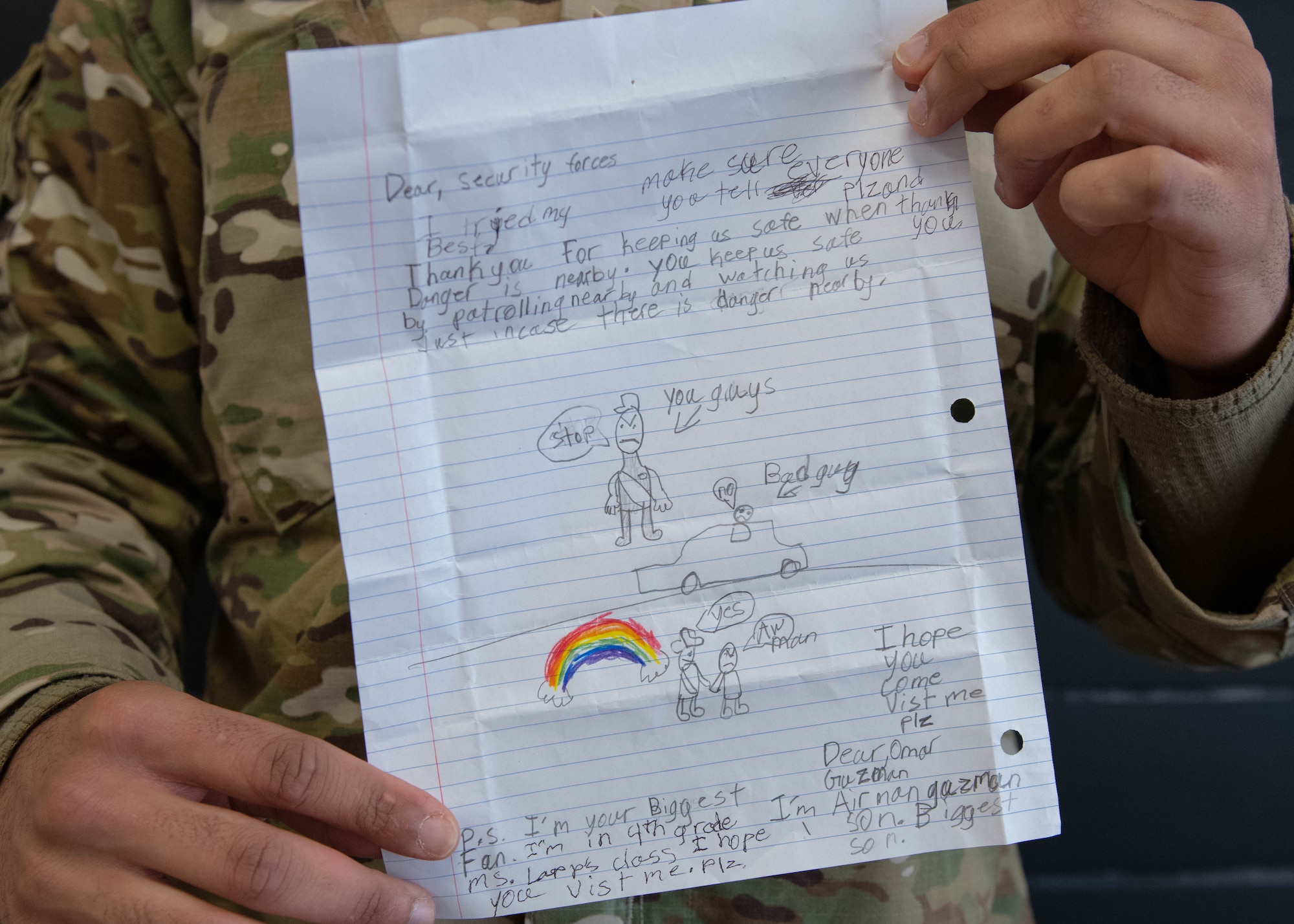 U.S. Air Force Airman 1st Class Dylan Wohlford, an installation entry controller assigned to the 509th Security Forces Squadron, holds the letter he received from Omar, an elementary school student at Whiteman Air Force Base, Missouri, on Feb. 26, 2021. Omar personally delivered the letter to Wohlford while he was on duty at Spirit Gate, to show his appreciation for the Air Force's defenders. (U.S. Air Force photo by Airman 1st Class Devan Halstead)