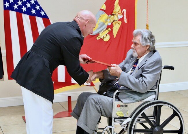 U.S. Marine Corps Col. John Polidoro, Chief of Staff, U.S. Marine Corps Forces Central Command, awards the Silver Star on Cpl. Salvatore Naimo, a Korean War Veteran in Sarasota, Florida on March 17, 2021.
