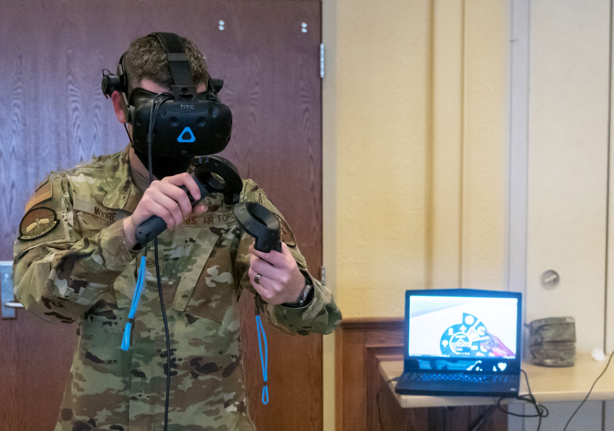 U.S. Air Force Staff Sgt. Braden Moore, 334th Training Squadron instructor, tests the airfield management virtual reality trainer during the 81st Training Group Next Level Showcase inside the Bay Breeze Event Center at Keesler Air Force Base, Mississippi, March 17, 2021. The showcase was the crowning point of the 81st TRG's past year technological and innovative think tank. (U.S. Air Force photo by Andre' Askew)