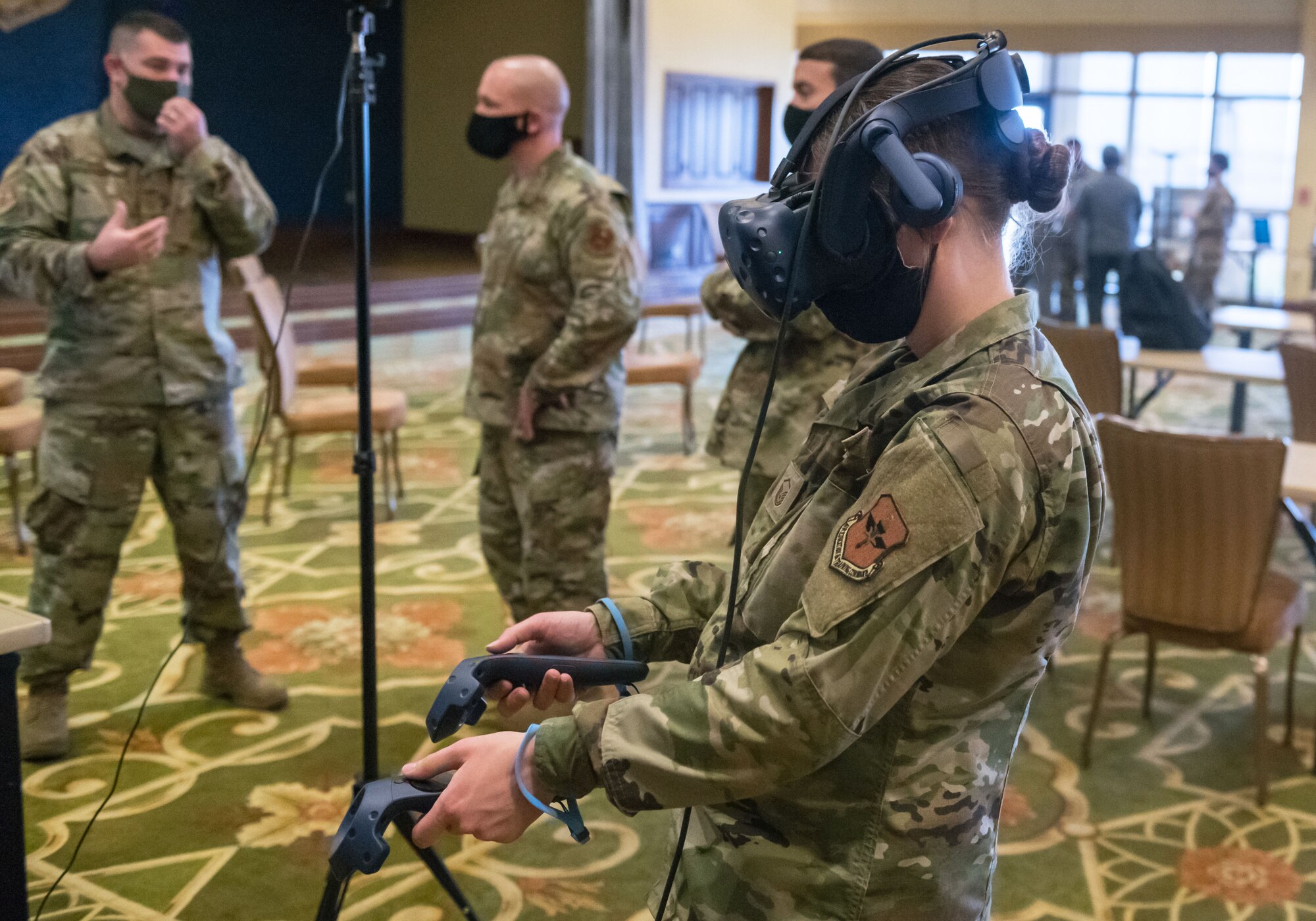 U.S. Air Force Master Sgt. Carol Ann Peteroli, 335th Training Squadron curriculum developer, interacts with the test cell calibration for the 2P Precision Measurement Equipment Lab Craftsman Course during the 81st Training Group Next Level Showcase inside the Bay Breeze Event Center at Keesler Air Force Base, Mississippi, March 17, 2021. The showcase was the crowning point of the 81st TRG's past year technological and innovative think tank. (U.S. Air Force photo by Andre' Askew)