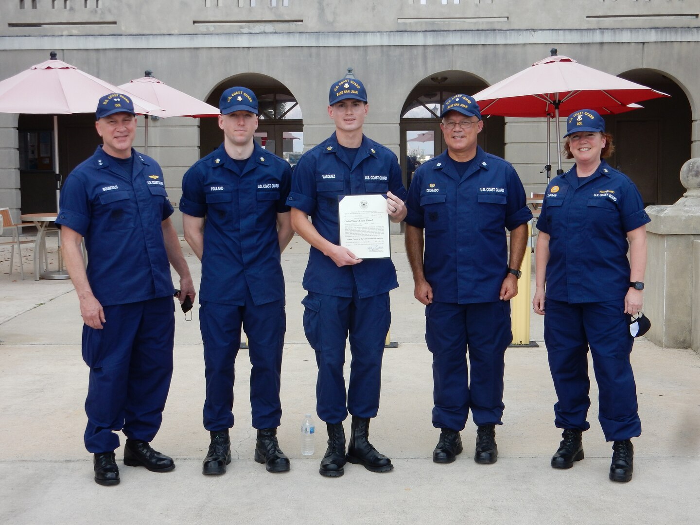Rear Adm. Mel Bouboulis,left, meritoriously advanced Adrian Vazquez (center) to electronics technician first class, March 15, 2021. Pictured from left to right: Rear Adm. Mel Bouboulis Petty Officer 2nd Class Jacob Polland; Petty Officer 1st Class Class Adrian Vazquez; Cmdr. Javier Delgado; and Master Chief Petty Officer Ann Logan.(U.S. Coast Guard photo)