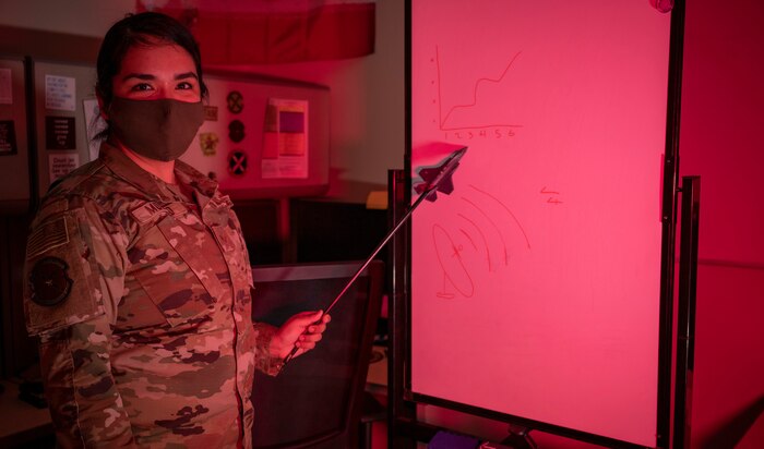 Airman points at graph.