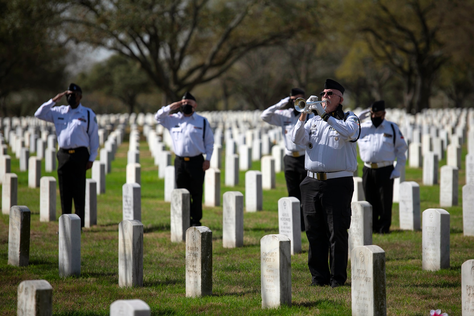 Mike Kinkade, bugler for the Fort Sam Houston Memorial Services Detachment, plays “Taps” during a funeral at the Fort Sam Houston National Cemetery in San Antonio March 15. The funeral marked the detachment’s 40,000th funeral service.