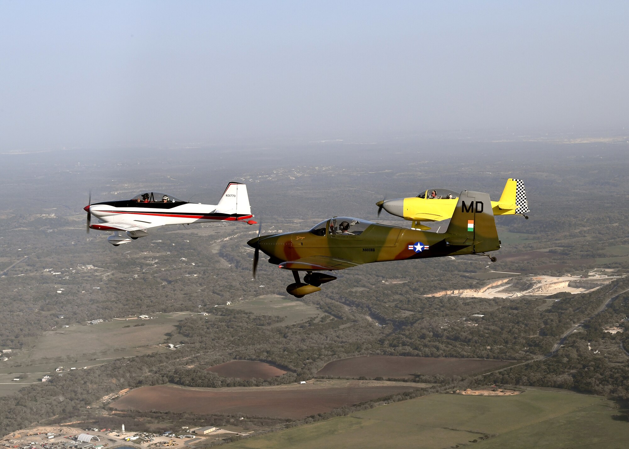 Maj. Cindy Piccirillo, 149th Fighter Wing director of inspections, flies over Bulverde, Texas, March 15, 2021, during a ride with Col. Raul Rosario, 149th FW commander, in an RV-4 airplane alongside similar aircraft.