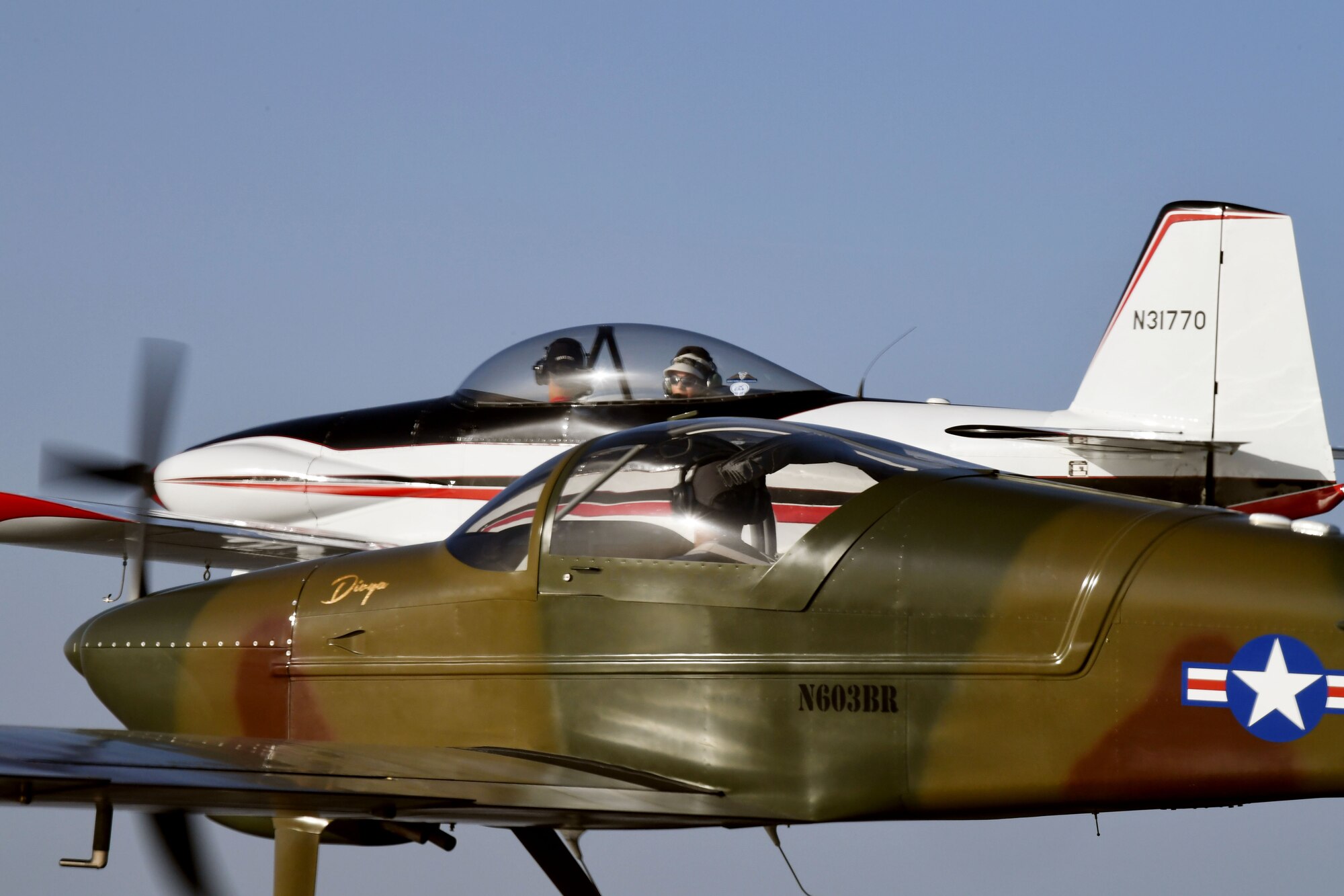 Maj. Cindy Piccirillo, 149th Fighter Wing director of inspections, flies over Bulverde, Texas, March 15, 2021, during a ride with Col. Raul Rosario, 149th FW commander, in an RV-4 airplane alongside similar aircraft.