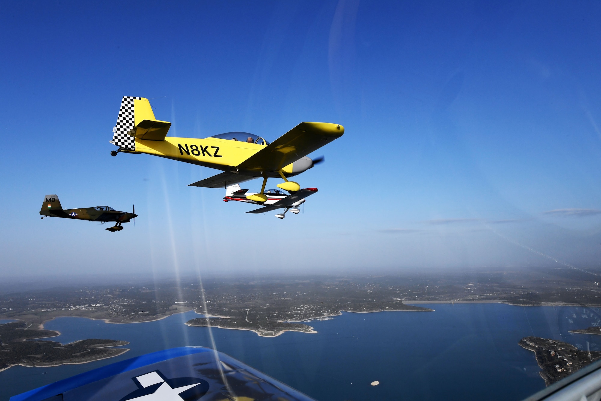 Maj. Cindy Piccirillo, 149th Fighter Wing director of inspections, flies over Bulverde, Texas, March 15, 2021, during a ride with Col. Raul Rosario, 149th FW commander, in an RV-4 airplane alongside similar aircraft.