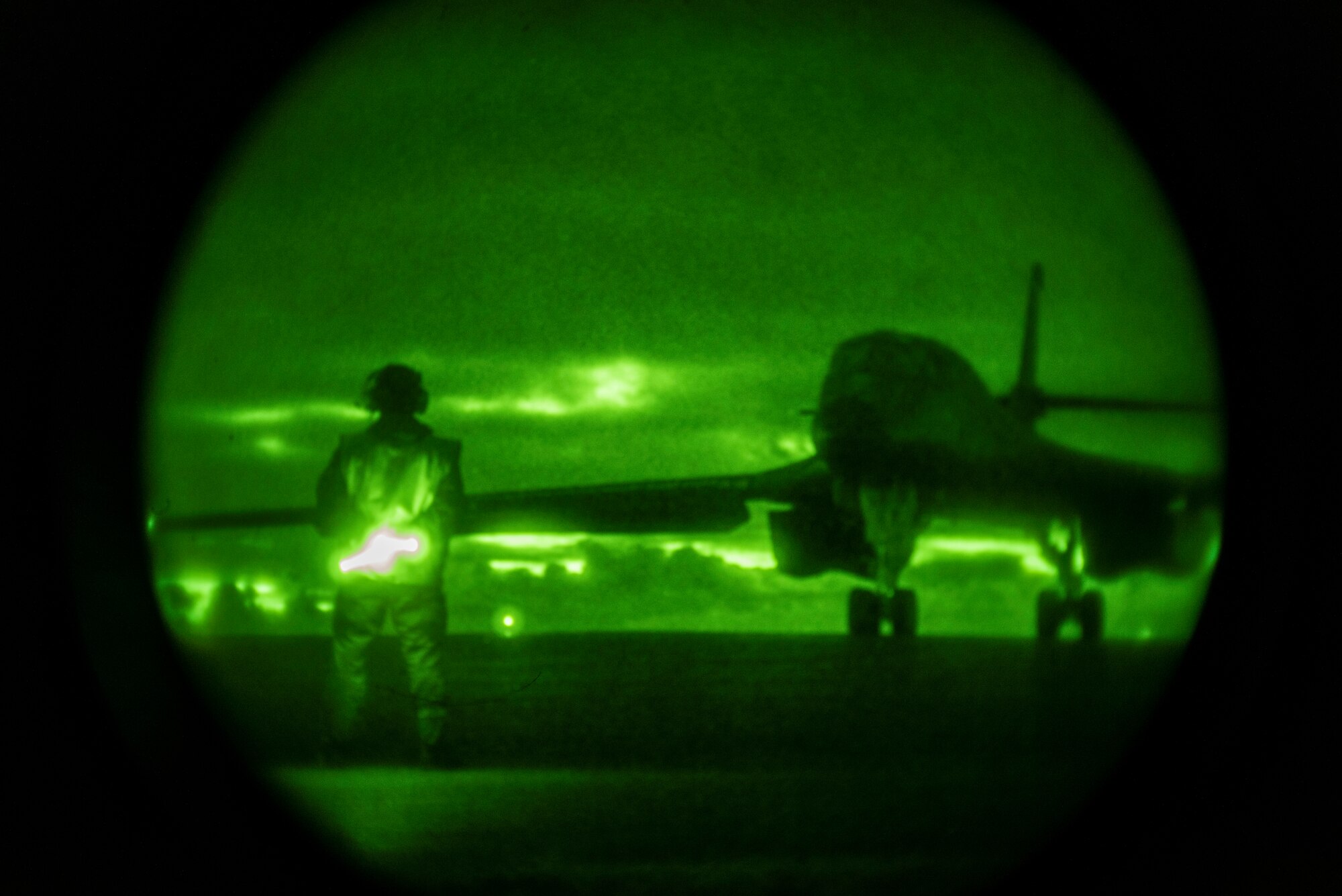 A 9th Expeditionary Bomb Squadron crew chief prepares to marshal a B-1B Lancer at Ørland Air Force Station, Norway, March 16, 2021. During the Bomber Task Force Europe deployment, the 9th EBS integrated and trained with six ally and partner nations. (U.S. Air Force photo by Airman 1st Class Colin Hollowell)