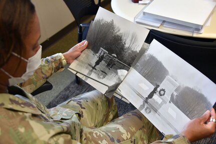 Sgt. Maj. Danyell (Wilson) Walters, senior enlisted adviser for U.S. Army Medical Logistics Command, looks through old photos from her time serving as a sentinel at the Tomb of the Unknown Soldier at Arlington National Cemetery in 1997. Walters is one of just four women to ever serve as a tomb guard with the prestigious 3rd U.S. Infantry Regiment, known as "The Old Guard."