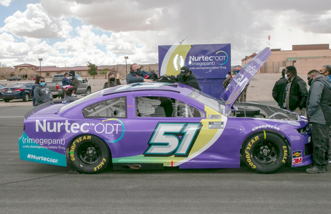 David Snyder, with the Marine Corps Exchange, crawls into the driver’s seat of the #51 car driven by Cody Ware during the 2021 NASCAR Cup Series racing season. The Rick Ware Racing Team visited MCLB Barstow, as well as other installations, as part of its Military Salutes program, March 11.