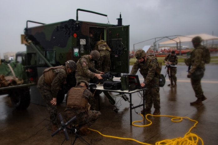 U.S. Marines from 1st Battalion, 12th Marines and U.S. Army soldiers from 5th Battalion, 3d Field Artillery Regiment conduct a High Mobility Artillery Rocket System Rapid Infiltration fire mission during Exercise Spartan Fury 21.1, Pacific Missile Range Facility, Kauai, Hawaii, March 12, 2021. Exercise Spartan Fury demonstrates 1/12’s ability to conduct distributed operations inside an adversary’s sensors and weapons engagement zone, attain and defend key maritime terrain, and conduct sea denial in support of fleet operations. (U.S. Marine Corps photo by Lance Cpl. Brandon Aultman)