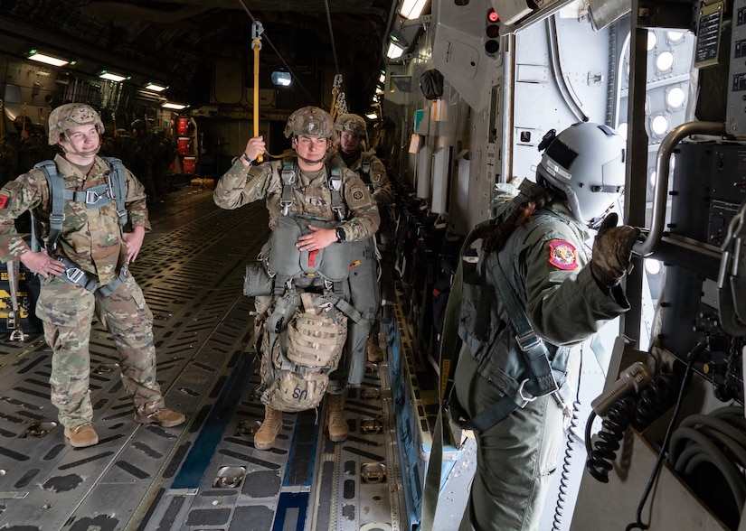 Women assigned to the 82nd Airborne Division, Pope Army Airfield, N.C., and 437th Airlift Wing, Joint Base Charleston, S.C., participated in an all-female flight in commemoration of Women’s History Month, March 17, 2021. The flight included 80 female paratroopers who boarded two C-17s with all-female crews to perform a jump. Due to weather constraints, the paratroopers were unable to complete their jump. (U.S. Air Force photo by Staff Sgt. Rachel Pye)