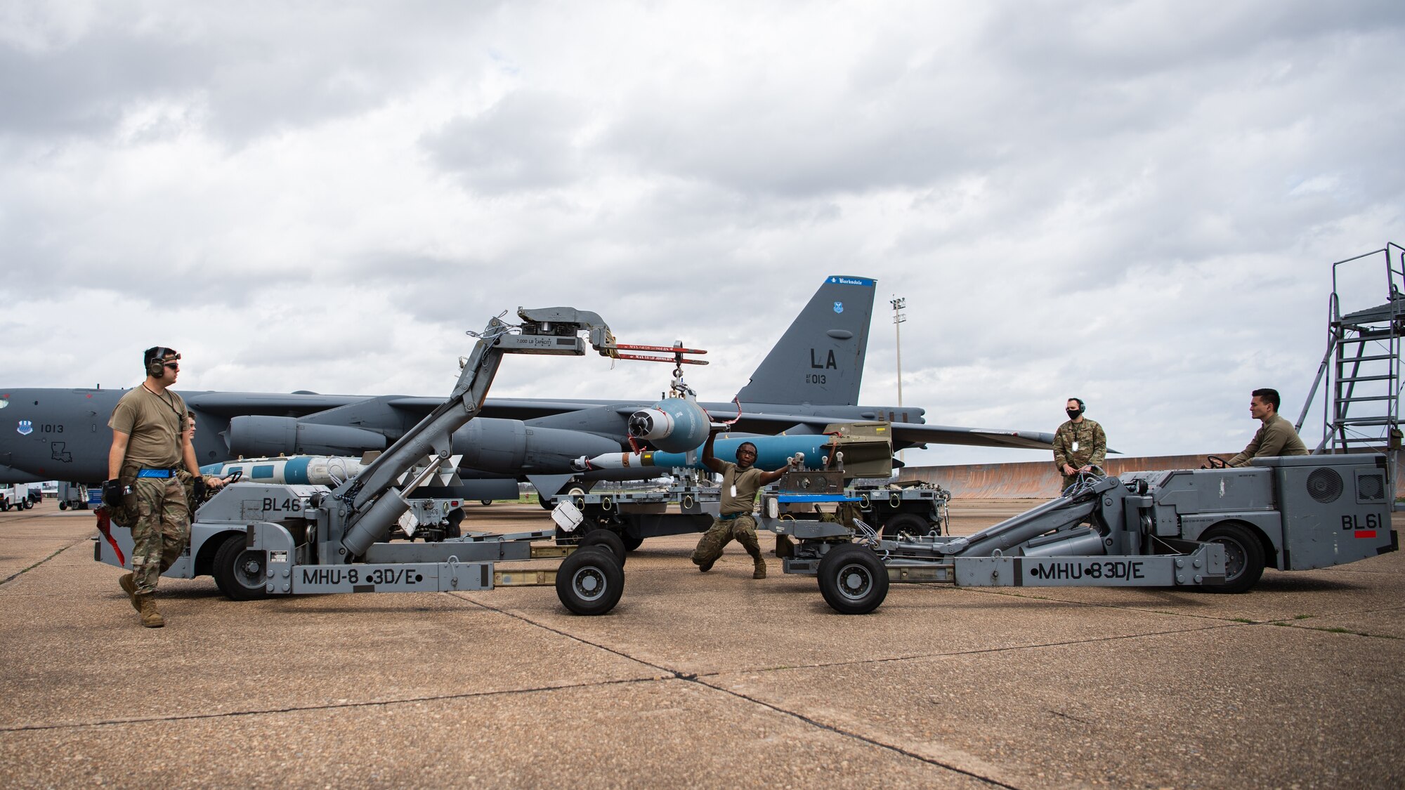 A weapons load crew from the 2nd Aircraft Maintenance Squadron transport a GBU-10 munition to be loaded onto a B-52H Stratofortress during Combat Hammer at Barksdale Air Force Base, La., March 10, 2021. Combat Hammer was a week-long evaluation of the wing’s capacity to generate, load and employ conventional weapons on target. (U.S. Air Force photo by Airman 1st Class Jacob B. Wrightsman)