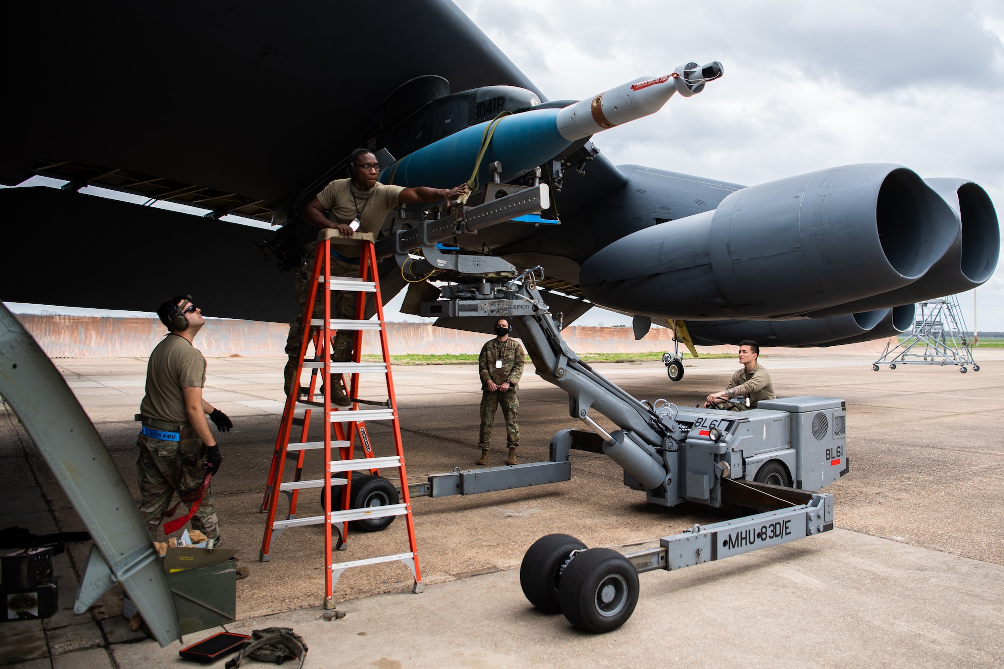 A weapons load crew from the 2nd Aircraft Maintenance Squadron load a GBU-10 munition onto a B-52H Stratofortress during Combat Hammer at Barksdale Air Force Base, La., March 10, 2021. Combat Hammer was an exercise that encompassed end-to-end evaluations from units across the wing, assessing proficiency across the board. (U.S. Air Force photo by Airman 1st Class Jacob B. Wrightsman)