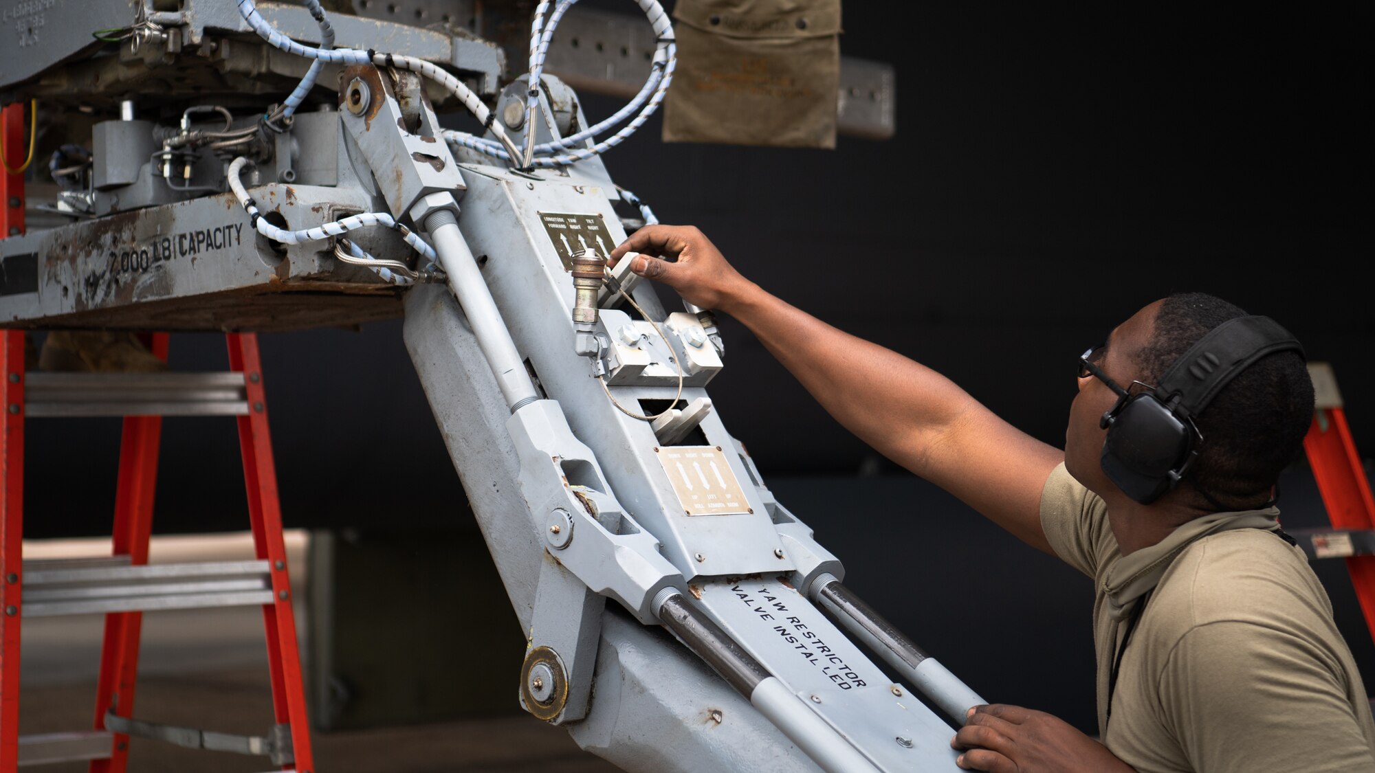 Senior Airman Christian X. Brewer, 2nd Aircraft Maintenance Squadron weapons load crew member, operates a MHU-83 to load munitions onto a B-52H Stratofortress during Combat Hammer at Barksdale Air Force Base, La., March 10, 2021. Airmen from the 2nd Bomb Wing flew an impressive eight for eight sortie generation and fly rate, something rarely seen across all combat platforms, not just bombers in support of the exercise. (U.S. Air Force photo by Airman 1st Class Jacob B. Wrightsman)