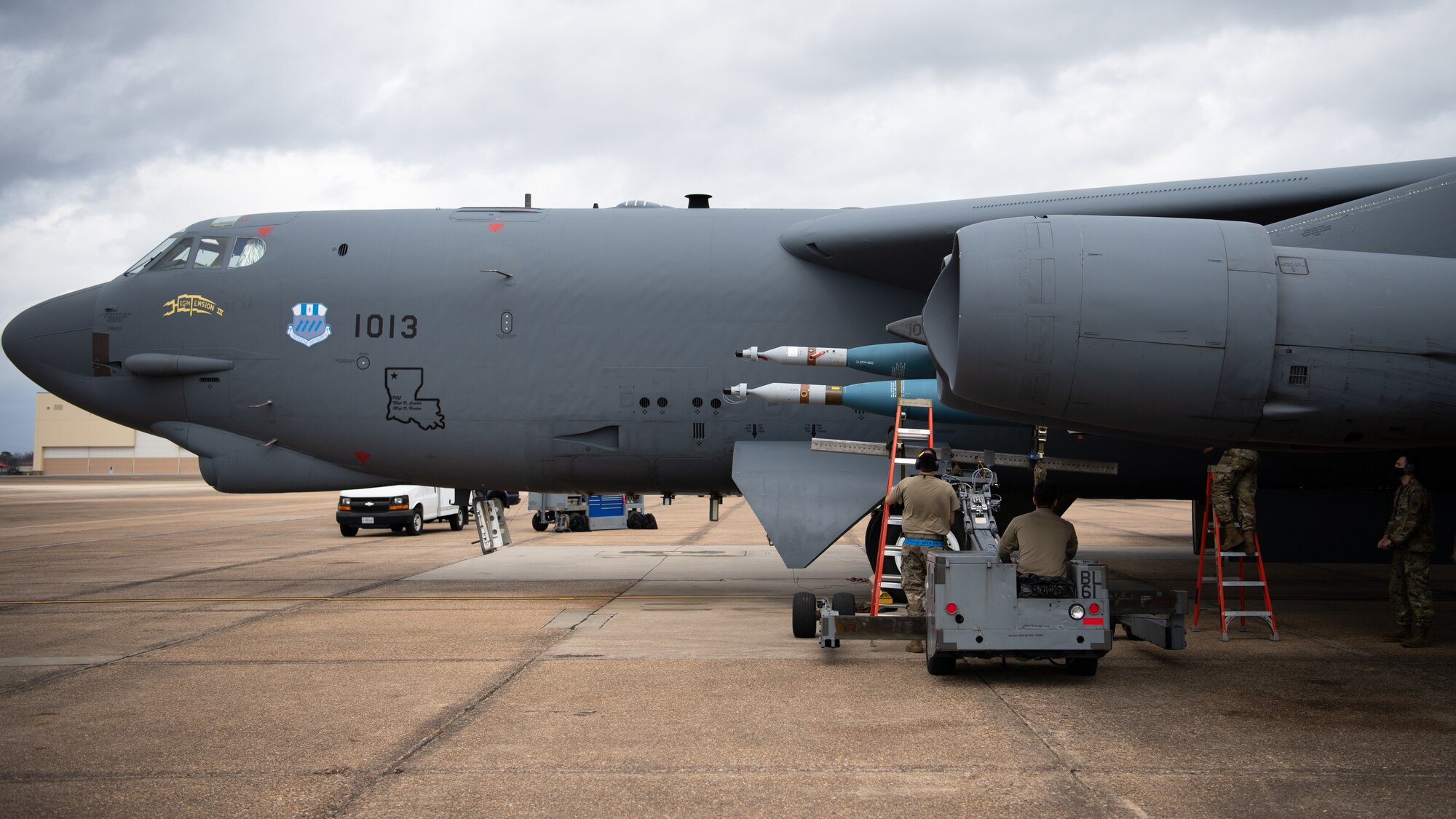 A weapons load crew from the 2nd Aircraft Maintenance Squadron transport a GBU-10 munition to be loaded onto a B-52H Stratofortress during Combat Hammer at Barksdale Air Force Base, La., March 10, 2021. Airmen from the 2nd Bomb Wing loaded and employed nearly 50 types of various munitions and flew a total of eight sorties in support of exercise Combat Hammer. (U.S. Air Force photo by Airman 1st Class Jacob B. Wrightsman)