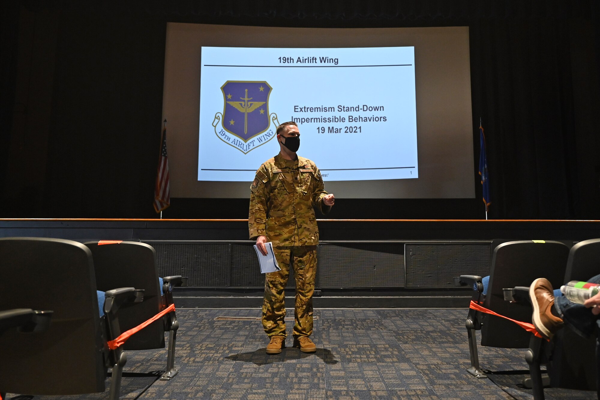 Airmen stands up and gives a brief