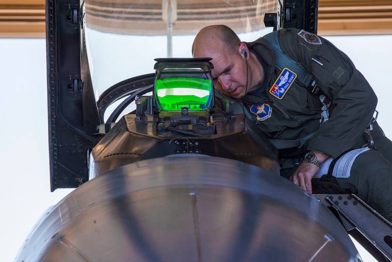 Col. Ryan Keeney, 49th Wing commander, prepares to get in an F-16 Viper during pre-flight checks, March 5, 2021, on Holloman Air Force Base, New Mexico. Keeney took part in the first few days of the Weapon System Evaluation Program with the 314th Fighter Squadron for their temporary duty training assignment to Tyndall Air Force Base, Florida. (U.S. Air Force photo by Airman 1st Class Quion Lowe)