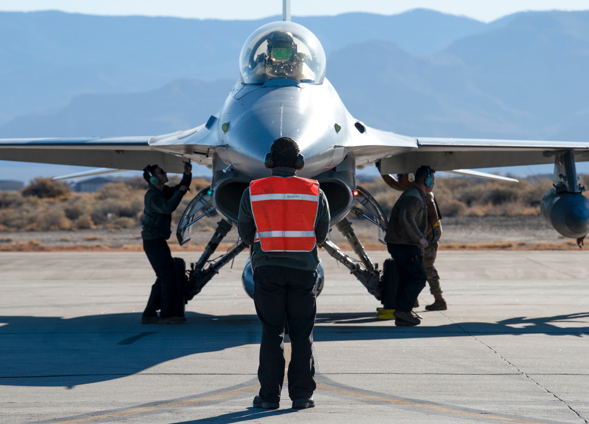 Airmen from the 314th Aircraft Maintenance Unit perform an end of runway inspection on an F-16 Viper, March 5, 2021, on Holloman Air Force Base, New Mexico. The Airmen were preparing for a temporary duty assignment for the Weapons Systems Evaluation Program at Tyndall AFB, Florida, where they worked in a joint environment to evaluate air-to-air weapons systems on behalf of Air Combat Command. (U.S. Air Force photo by Airman 1st Class Quion Lowe)