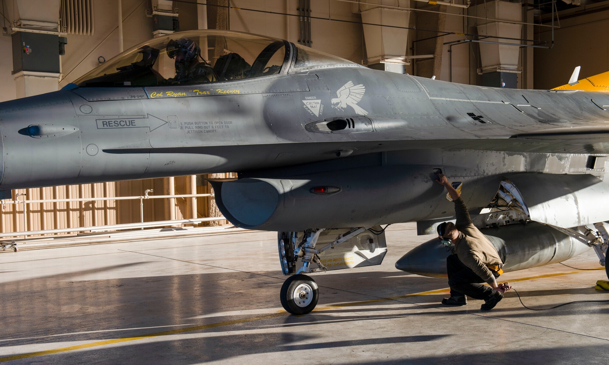 Lt. Col. Michael Mullin, 314th Fighter Squadron commander, prepares to take off as Senior Airman Wyatt Nevins, 314th Aircraft Maintenance Unit crew chief, performs pre-flight checks prior to taxi onto the runway, March 5, 2021, on Holloman Air Force Base, New Mexico. Mullin was the detachment commander for all Holloman units during the Weapons System Evaluation Program at Tyndall AFB, Florida. (U.S. Air Force photo by Airman 1st Class Quion Lowe)