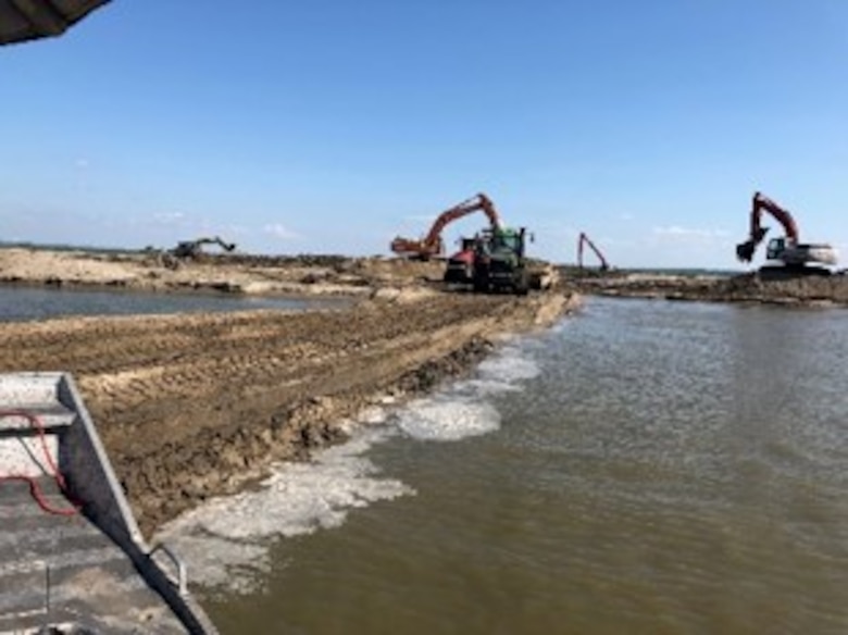 Crews repair one of the levees damaged along the Missouri River.