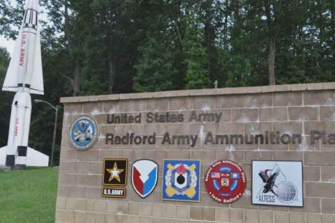 A sign made of brick reads "United States Army - Radford Army Ammunition Plant."