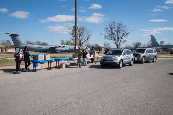 Members from the 97th Air Mobility Wing host an Armed Services YMCA (ASYMCA) open house drive-thru event at Altus Air Force Base, Oklahoma, March 18, 2021. The ASYMCA hosted the event to educate Airmen and their families on the various resources and programs available to them. (U.S. Air Force photo by Airman 1st Class Amanda Lovelace)