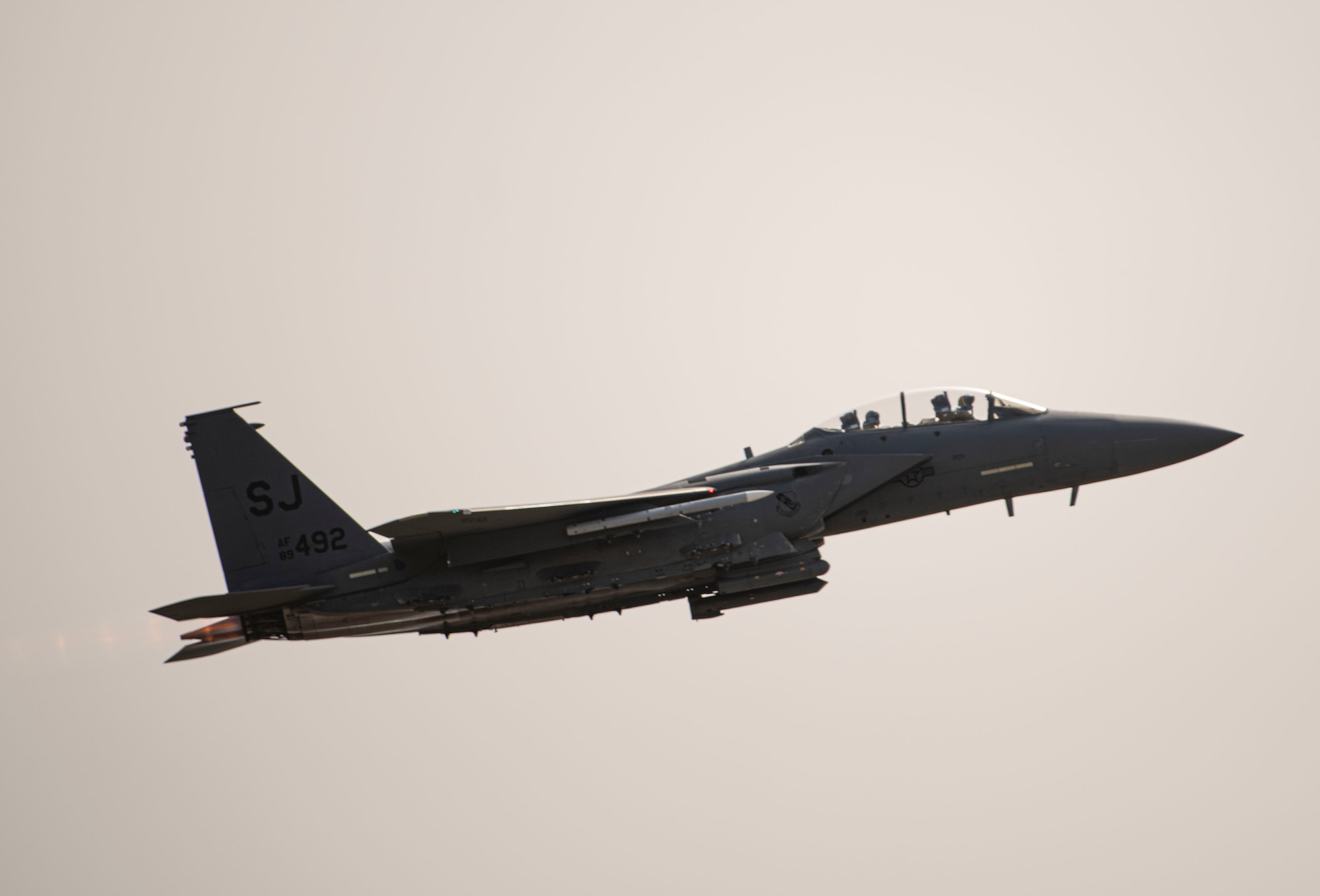 an F-16 fighter jet flies through the air