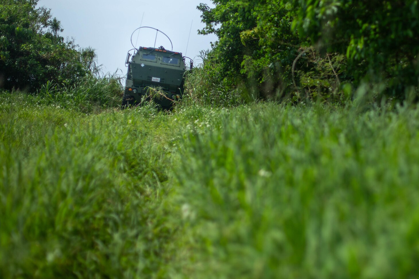 A 3d Marine Division High Mobility Artillery Rocket System travels to a hide spot after a HIMARS assault during Castaway 21.1 at Ie Shima, Okinawa, Japan, March 15, 2021. Exercise Castaway 21.1 sought to demonstrate USMC joint capability to seize and secure key maritime terrain, provide low signature sustainment, and execute long range precision fires in support of Naval Operations.