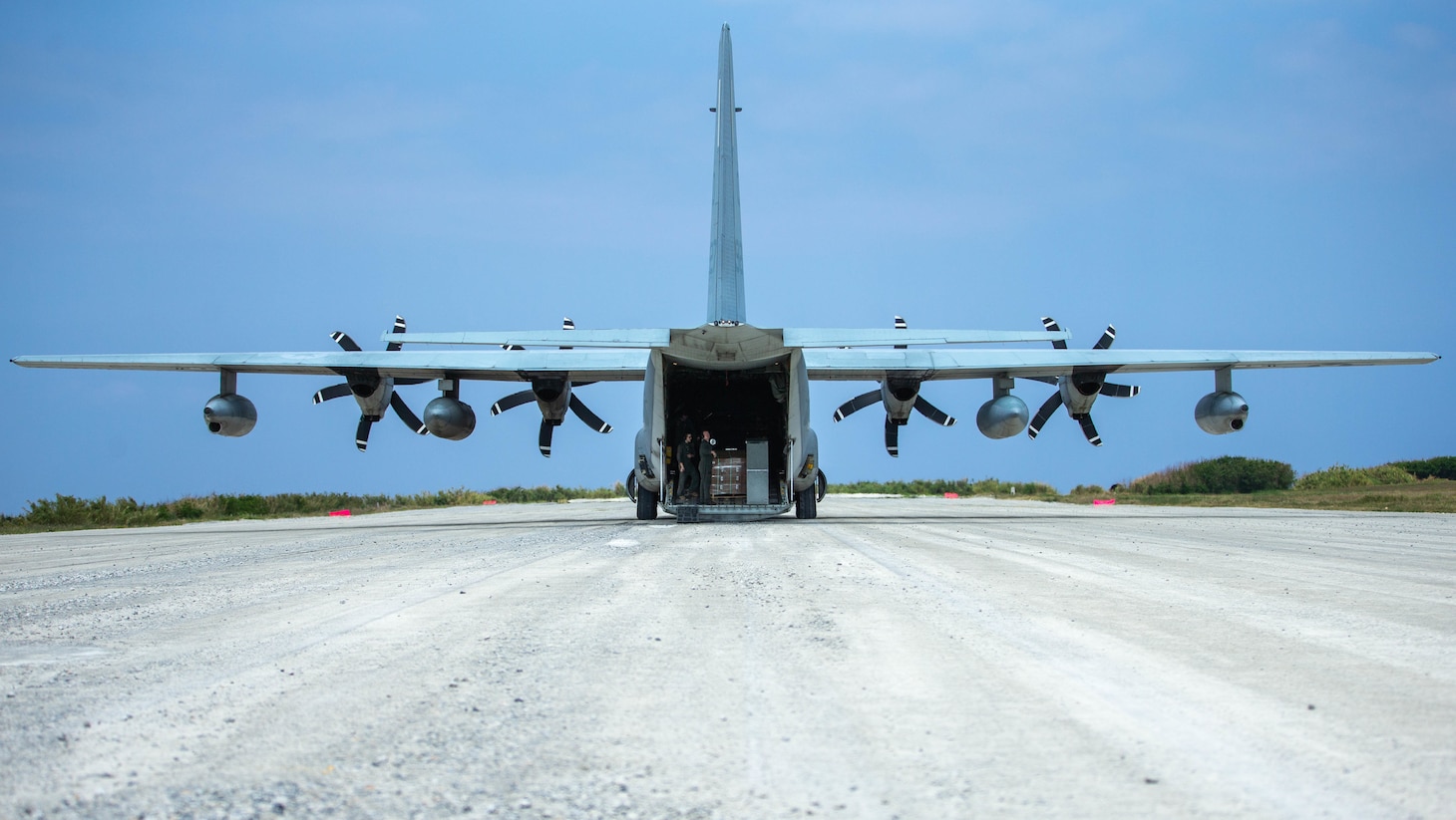 A 1st Marine Aircraft Wing C-130 delivers supplies to 3d Marine Division during Castaway 21.1 at Ie Shima, Okinawa, Japan, March 15, 2021. Exercise Castaway 21.1 sought to demonstrate USMC joint capability to seize and secure key maritime terrain, provide low signature sustainment, and execute long range precision fires in support of Naval Operations.