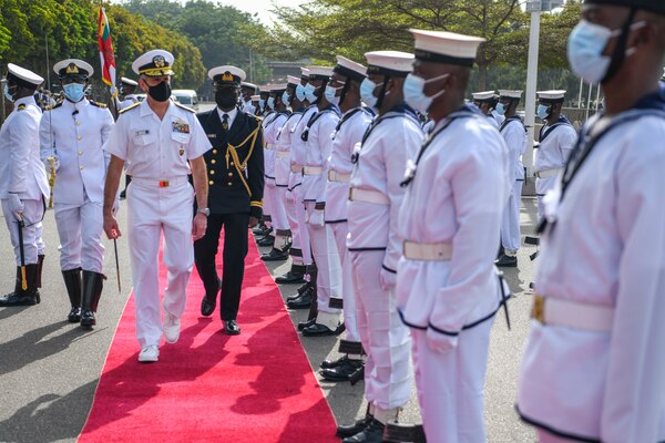 Adm. Robert P. Burke inspects the Ghanaian navy’s honor guard during the opening ceremony of Exercise Obangame Express 2021.