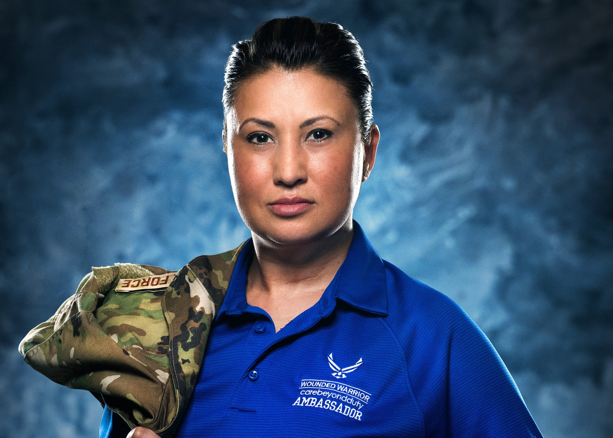 Master Sgt. Bronwen Gulledge, 26th Space Aggressor Squadron, Adversary Intelligence Flight, flight superintendent, poses in her Air Force Wounded Warrior Program ambassador shirt, Feb. 19, at  Schriever Air Force Base, Colorado.