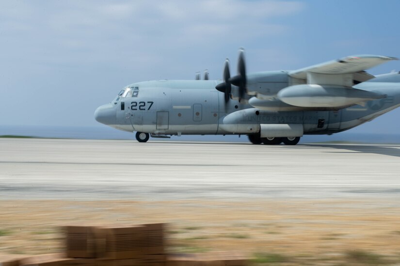 A 1st Marine Aircraft Wing C-130 departs after delivering supplies to 3d Marine Division during Castaway 21.1 at Ie Shima, Okinawa, Japan, March 15, 2021. Exercise Castaway 21.1 sought to demonstrate USMC joint capability to seize and secure key maritime terrain, provide low signature sustainment, and execute long range precision fires in support of Naval Operations.