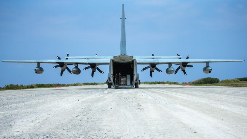 A 1st Marine Aircraft Wing C-130 delivers supplies to 3d Marine Division during Castaway 21.1 at Ie Shima, Okinawa, Japan, March 15, 2021. Exercise Castaway 21.1 sought to demonstrate USMC joint capability to seize and secure key maritime terrain, provide low signature sustainment, and execute long range precision fires in support of Naval Operations.