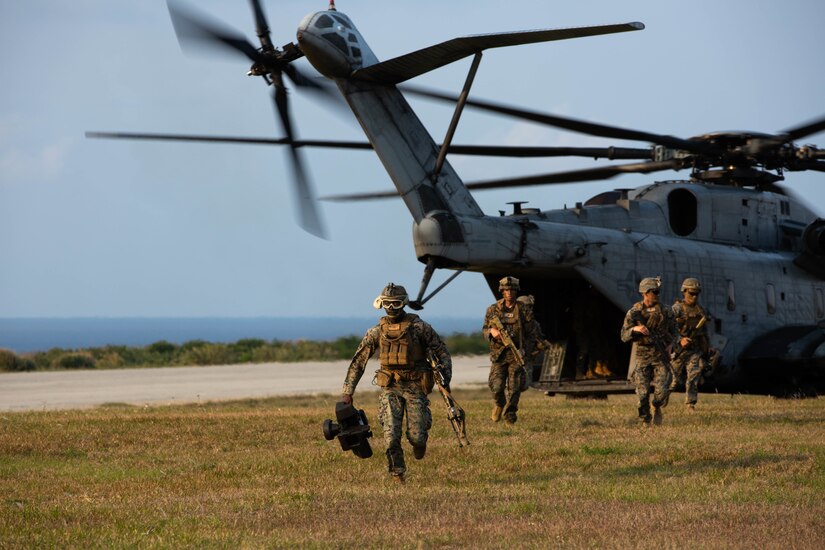 U.S. Marines with 3d Battalion, 8th Marine Regiment, exit a CH-53E Super Stallion during Castaway 21.1 to conduct an air assault on Ie Shima, Okinawa, Japan March 11, 2021. The exercise demonstrated the Marine Corps’ ability to integrate with the joint force to seize and defend key maritime terrain, provide low-signature sustainment, and execute long-range precision fires in support of naval operations from an expeditionary advanced base. 3/8 is currently attached to 3d Marine Division under the Unit Deployment Program.