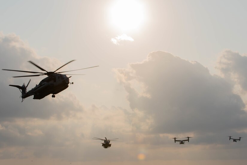 U.S. Marine Corps CH-53E Super Stallions and MV-22 Ospreys with 1st Marine Aircraft Wing transport Marines with 3d Battalion, 8th Marine Regiment executing an air assault during Castaway 21.1 at Ie Shima, Okinawa, Japan, March 11, 2021. The exercise demonstrated the Marine Corps’ ability to integrate with the joint force to seize and defend key maritime terrain, provide low-signature sustainment, and execute long-range precision fires in support of naval operations from an expeditionary advanced base. 3/8 is currently attached to 3d Marine Division under the Unit Deployment Program.