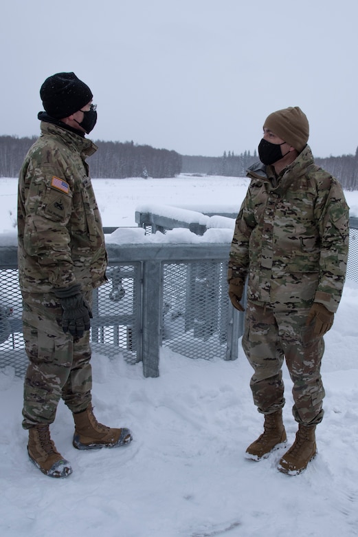 Maj. Gen. William Graham, deputy commanding general of civil and emergency operations for the U.S. Army Corps of Engineers, discusses the Chena River Lakes Flood Control Project with Col. Damon Delarosa, USACE Alaska District commander, on top of the Moose Creek Dam control works on Feb. 19 in North Pole.