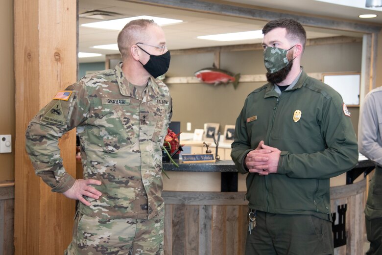 Maj. Gen. William Graham, deputy commanding general of civil and emergency operations for the U.S. Army Corps of Engineers, and Justin Kerwin, senior park ranger for the Chena River Lakes Flood Control Project, discuss the unique challenges of working in Alaska at the project office on Feb. 19.