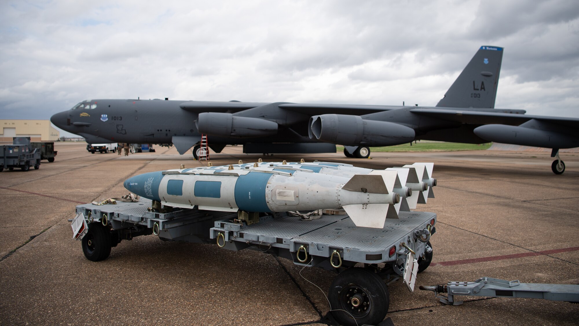 GBU-31 munitions sit in front of a B-52H Stratofortress during Combat Hammer at Barksdale Air Force, La., March 10, 2021. Airmen from the 2nd Bomb Wing flew an impressive eight for eight sortie generation and fly rate, something rarely seen across all combat platforms, not just bombers in support of the exercise. (U.S. Air Force photo by Airman 1st Class Jacob B. Wrightsman)