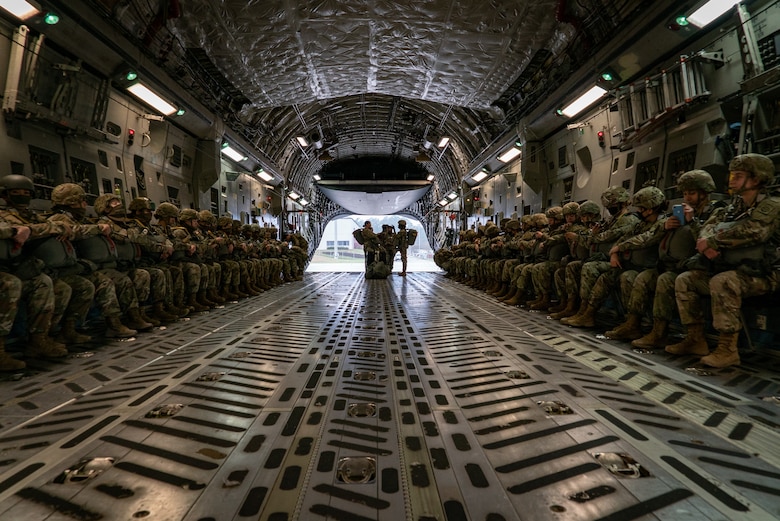 Women assigned to the 82nd Airborne Division, Pope Army Airfield, N.C., and 437th Airlift Wing, Joint Base Charleston, S.C., participated in an all-female flight in commemoration of Women's History Month, March 17, 2021. The flight included 80 female paratroopers who boarded two C-17s with all-female crews to perform a jump. Due to weather constraints, the paratroopers were unable to complete their jump. (U.S. Air Force photo by Staff Sgt. Rachel Pye)