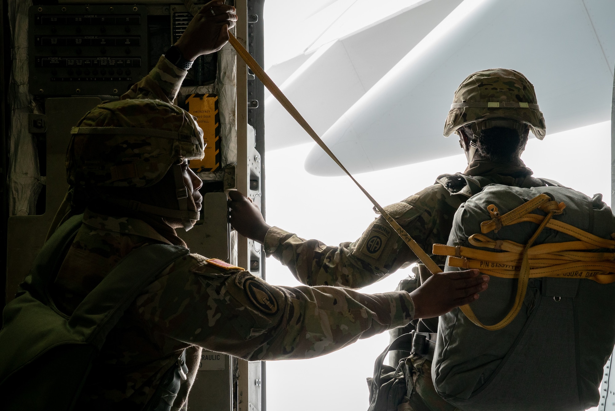 Women assigned to the 82nd Airborne Division, Pope Army Airfield, N.C., and 437th Airlift Wing, Joint Base Charleston, S.C., participated in an all-female flight in commemoration of Women’s History Month, March 17, 2021. The flight included 80 female paratroopers who boarded two C-17s with all-female crews to perform a jump. Due to weather constraints, the paratroopers were unable to complete their jump. (U.S. Air Force photo by Staff Sgt. Rachel Pye)