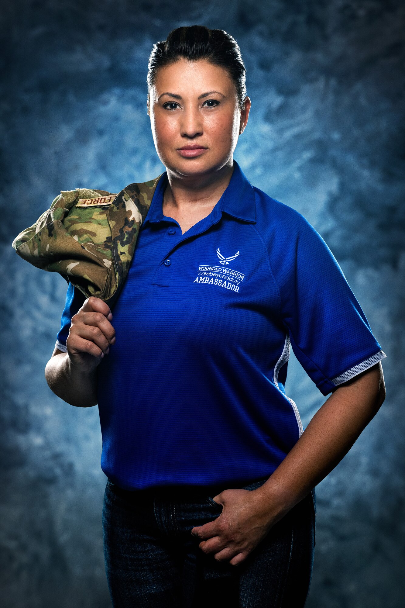 Master Sgt. Bronwen Gulledge, 26th Space Aggressor Squadron, Adversary Intelligence Flight, flight superintendent, poses in her Air Force Wounded Warrior Program ambassador shirt, Feb. 19, at  Schriever Air Force Base, Colorado.
