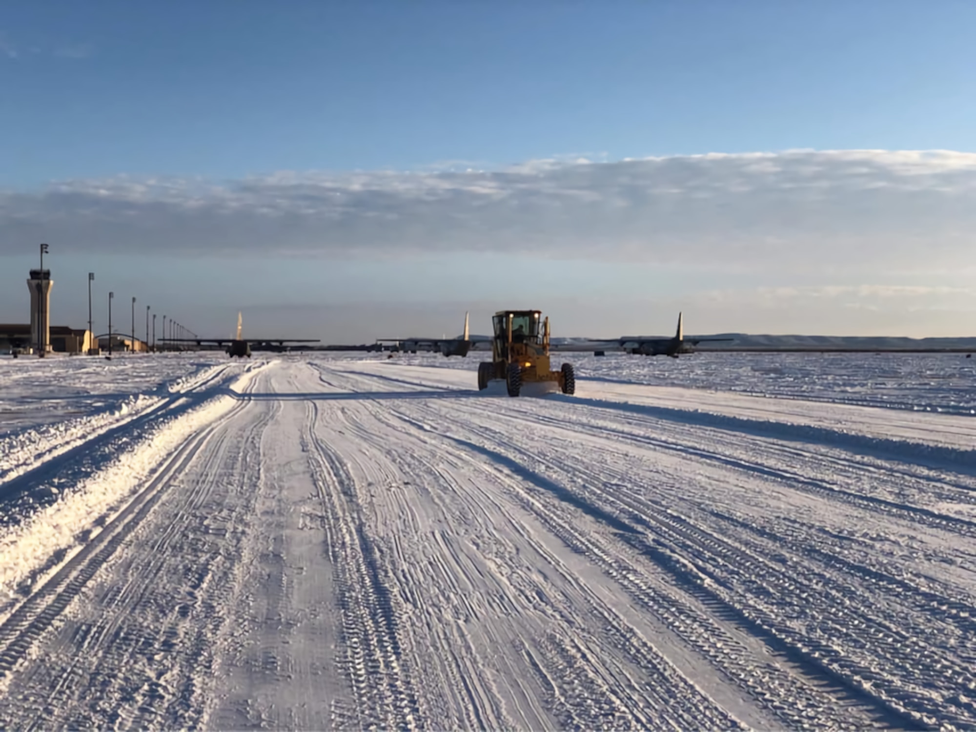 Airmen with the 7th Bomb Wing use snowplows to clear out the snow at Dyess Air Force Base, Texas, February 19th 2021.