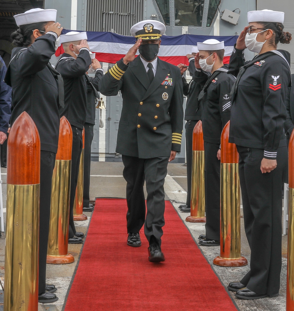 YOKOSUKA, Japan (March 19, 2021) Capt. Walter Mainor is greeted during a change of command ceremony aboard the Arleigh-Burke class guided-missile destroyer USS Mustin (DDG 89) while in port at Naval Base Yokosuka. (US Navy photo by Mass Communication Specialist 3rd Class Arthur Rosen)