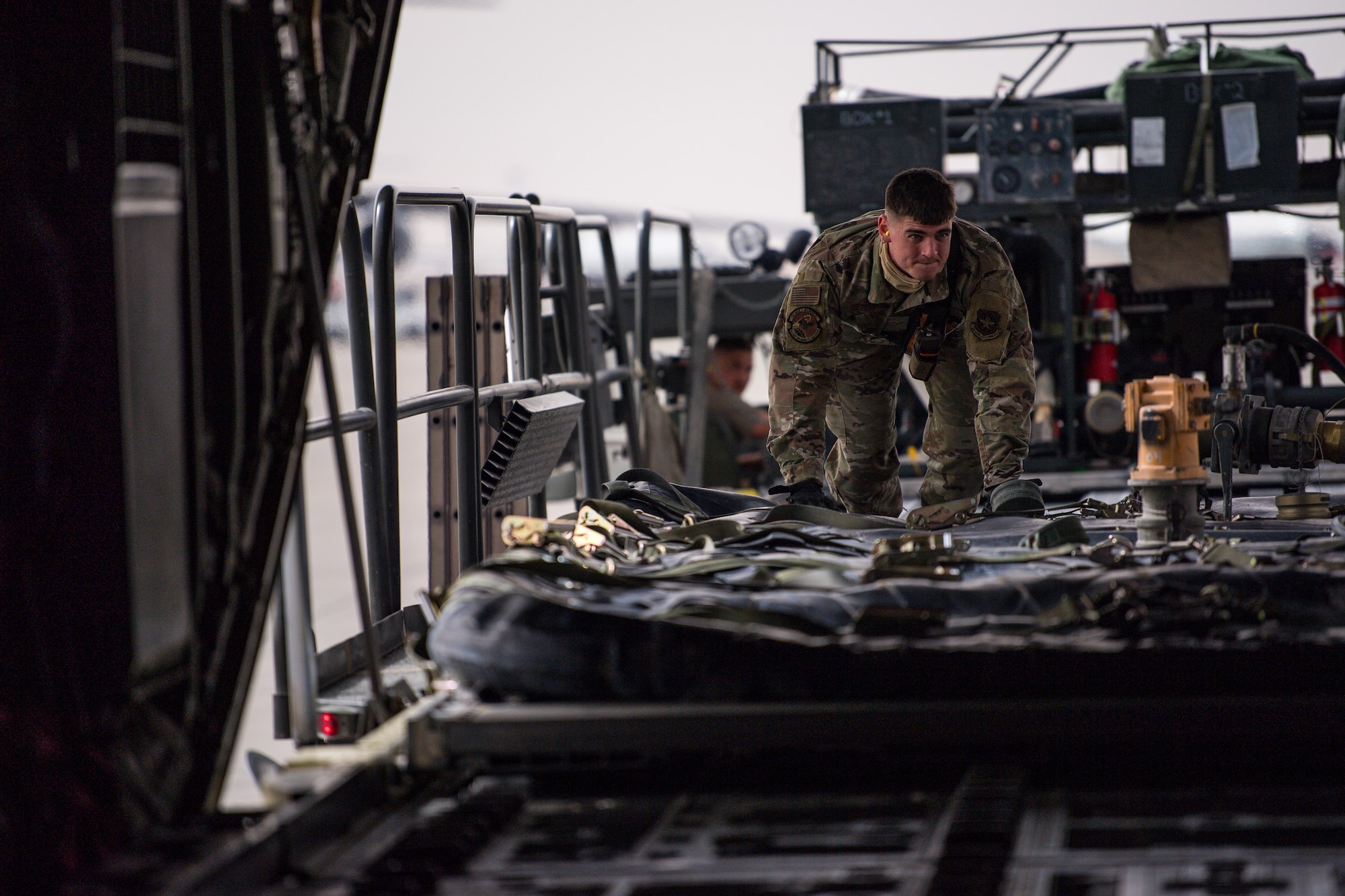 A U.S. Air Force C-130J Super Hercules aircraft, assigned to the 39th Expeditionary Airlift Squadron, is loaded with an Aerial Bulk Fuels Delivery System, at Al Udeid Air Base, Qatar, March 15, 2021.