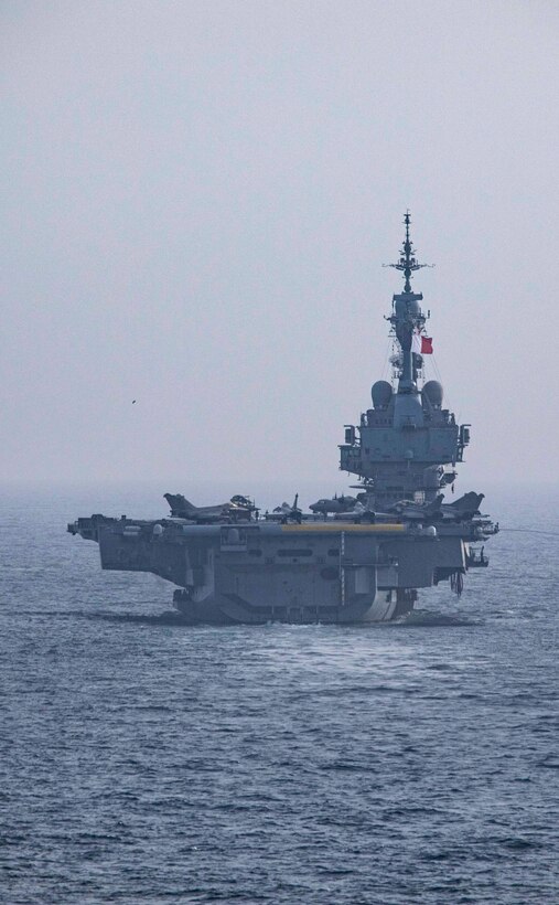 ARABIAN SEA (March 19, 2021) – French Navy aircraft carrier FS Charles de Gaulle (R 91), transits the Arabian Sea in support of Gulf Arabian Sea Warfare Exercise (GASWEX) 21. GASWEX 21 is a multilateral maritime exercise in the Arabian Sea and Gulf of Oman, with France, Belgium, Japan, and U.S., which provides a unique opportunity for participating forces to enhance mutual interoperability and capabilities in maritime security, anti-air warfare, anti-surface warfare, and anti-submarine warfare operations, allowing participating naval forces to effectively develop the necessary skills to address threats to regional security, freedom of navigation and the free flow of commerce. (U.S. Navy photo by Mass Communication Specialist 2nd Class Jeremy Laramore)