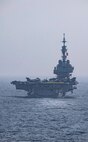 ARABIAN SEA (March 19, 2021) – French Navy aircraft carrier FS Charles de Gaulle (R 91), transits the Arabian Sea in support of Gulf Arabian Sea Warfare Exercise (GASWEX) 21. GASWEX 21 is a multilateral maritime exercise in the Arabian Sea and Gulf of Oman, with France, Belgium, Japan, and U.S., which provides a unique opportunity for participating forces to enhance mutual interoperability and capabilities in maritime security, anti-air warfare, anti-surface warfare, and anti-submarine warfare operations, allowing participating naval forces to effectively develop the necessary skills to address threats to regional security, freedom of navigation and the free flow of commerce. (U.S. Navy photo by Mass Communication Specialist 2nd Class Jeremy Laramore)
